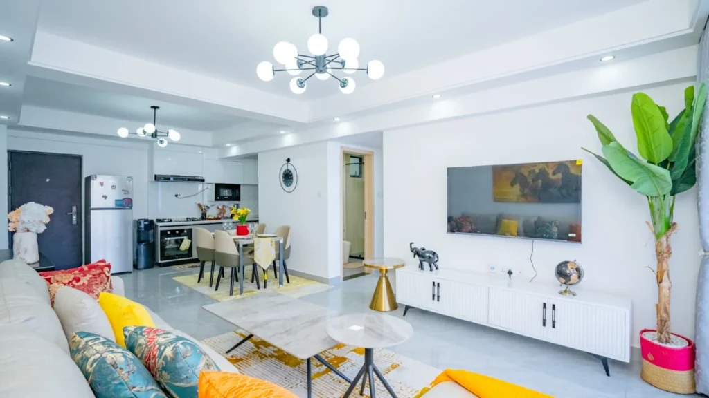 Spacious modern open-plan living room and dining area with modern lighting at Orchid Residency Westlands