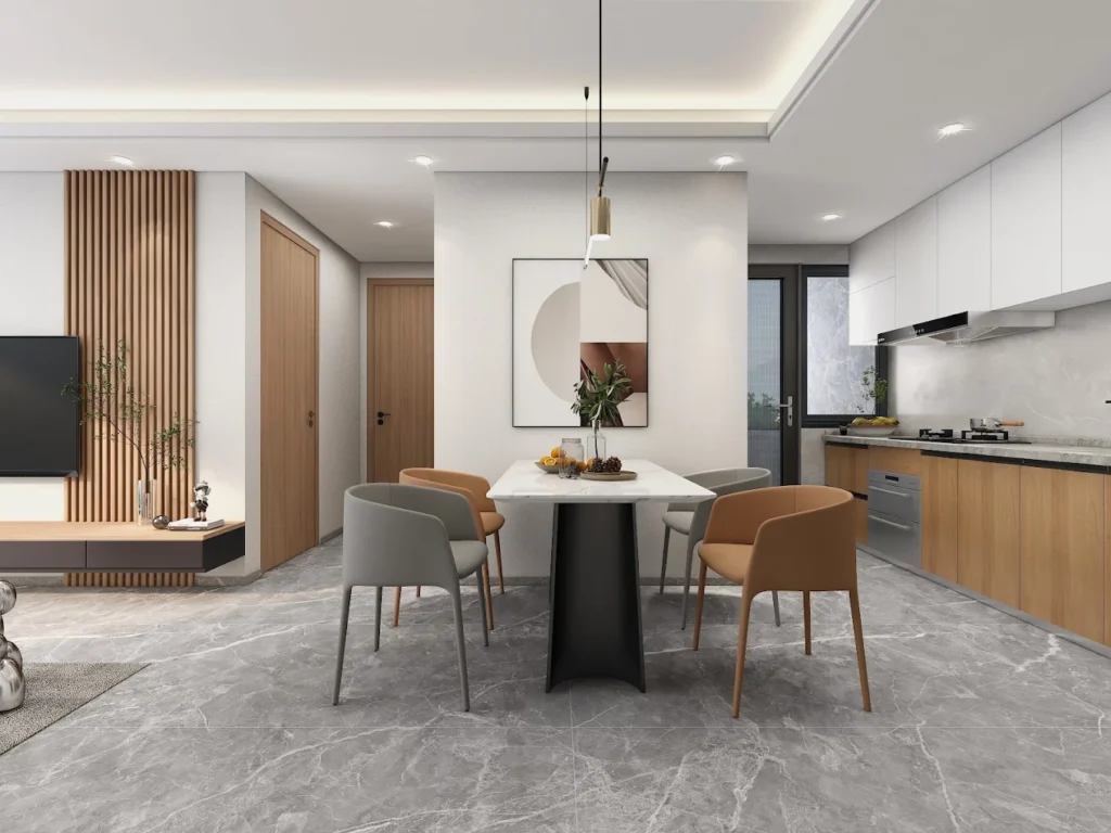 Modern open-plan dining space with marble-top table and accent wall paneling at Orchid Residency