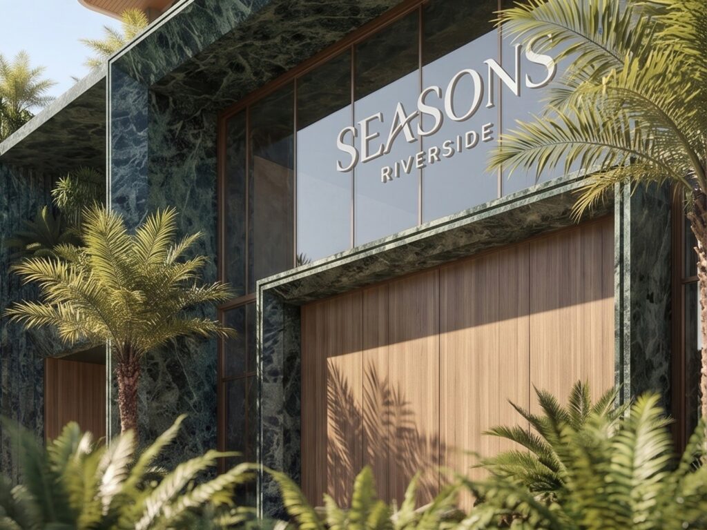 Branded entrance facade at Seasons Riverside Apartments