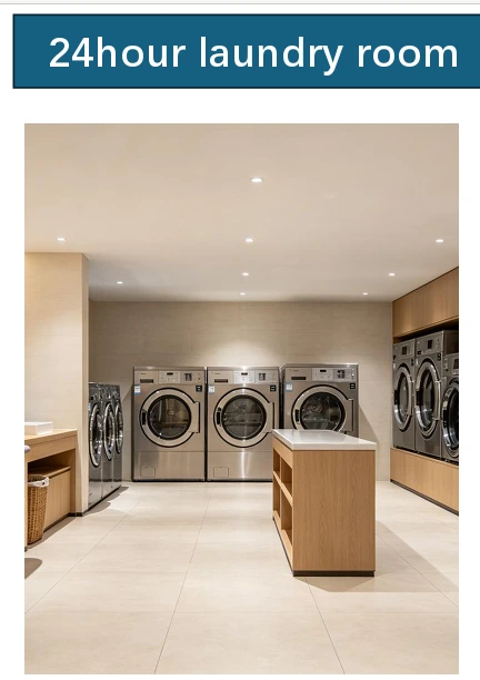 Modern 24-hour commercial laundry room equipped with multiple stainless-steel front-load washing machines and tumble dryers at Longines Bay in Kilimani, Nairobi