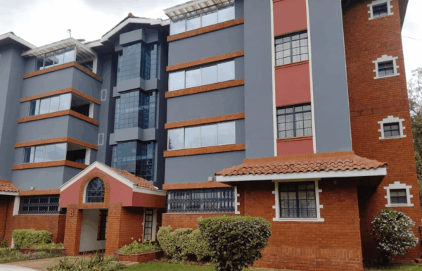 Red brick and grey exterior facade of Capital Apartments 18-unit residential building in Valley Arcade Lavington