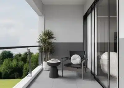 Private apartment balcony with glass railing seating area at Ten50 Residences Kilimani