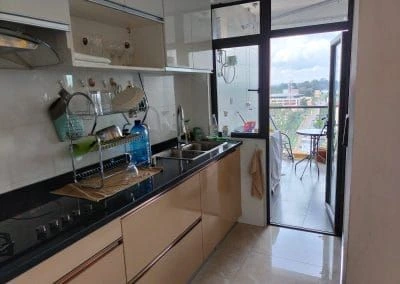 Fitted kitchen with black granite counter opening to private balcony at Urban Oasis Lavington