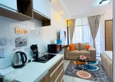 Living room seating area and doorway layout at Valley Heights Apartments Lavington