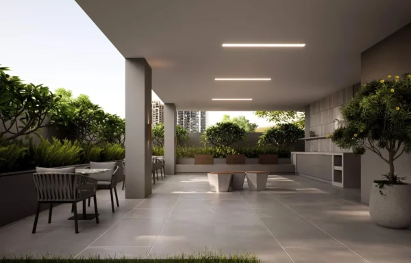 Covered outdoor terrace lounge with tropical planters and dining tables at Venice Tower Kilimani